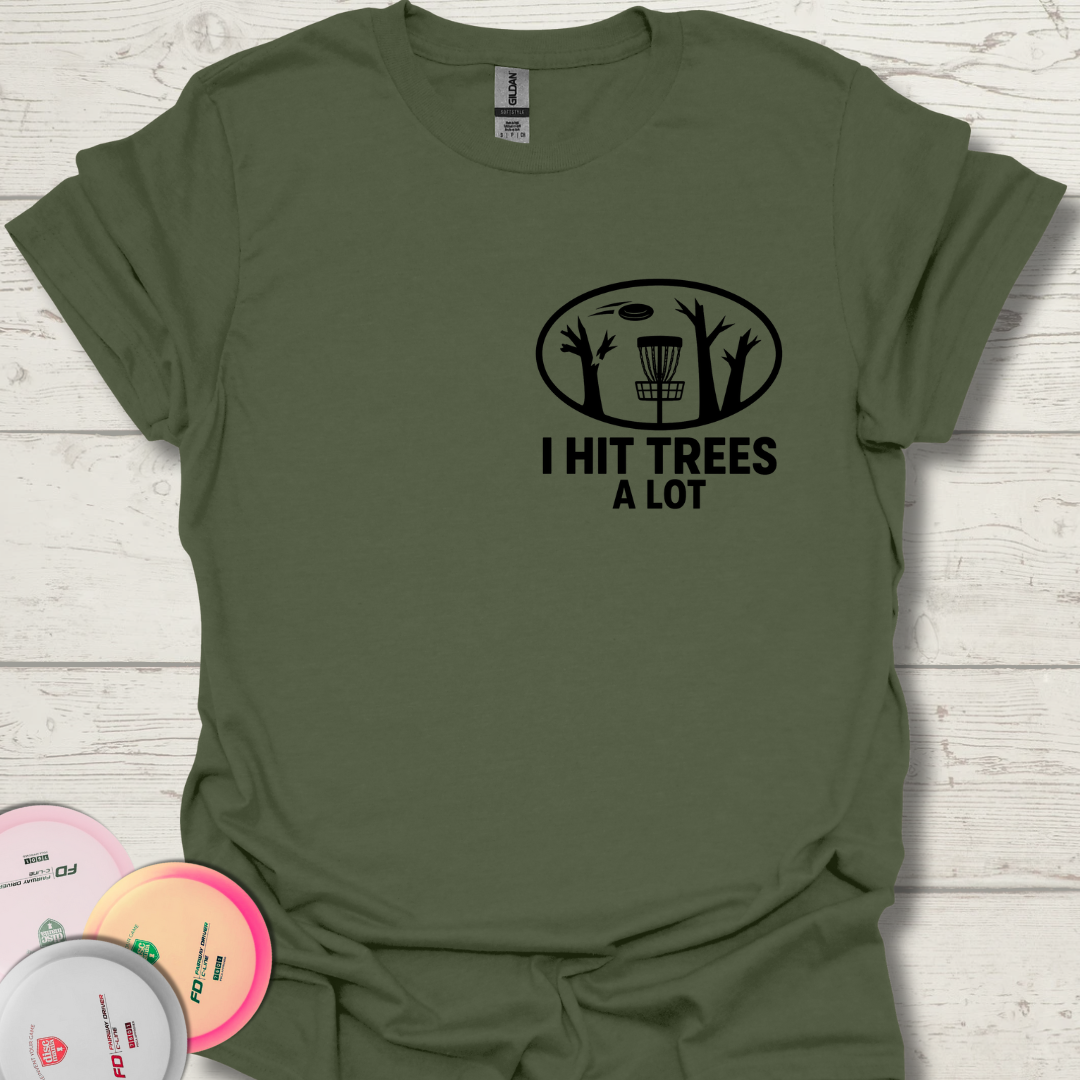 Flat lay of I Hit Trees a Lot disc golf t-shirt on table.