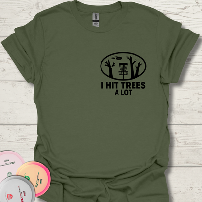 Flat lay of I Hit Trees a Lot disc golf t-shirt on table.