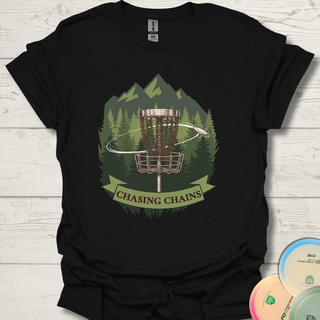 Chasing Chains disc golf t-shirt with basket and forest design. White Chasing Chains frisbee golf shirt with mountains and trees. Unisex Chasing Chains disc golf tee styled with colorful discs.
