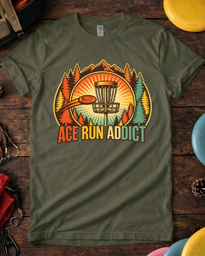 Unisex Ace Run Addict frisbee golf shirt laid flat with discs. Close-up of Ace Run Addict disc golf graphic and typography