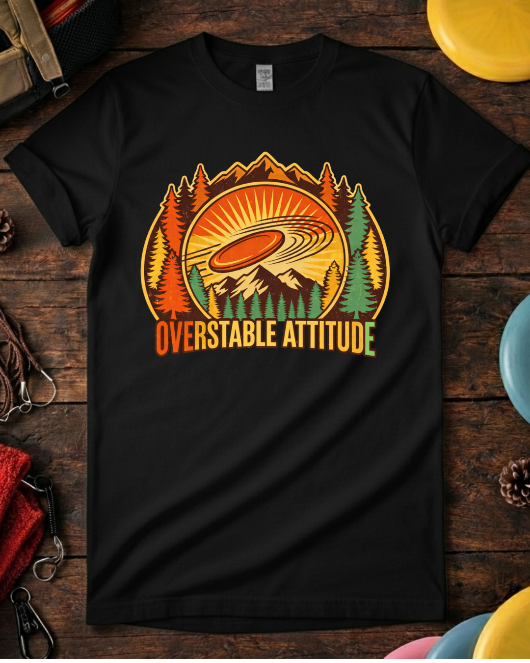 Unisex Overstable Attitude disc golf shirt laid flat with discs.