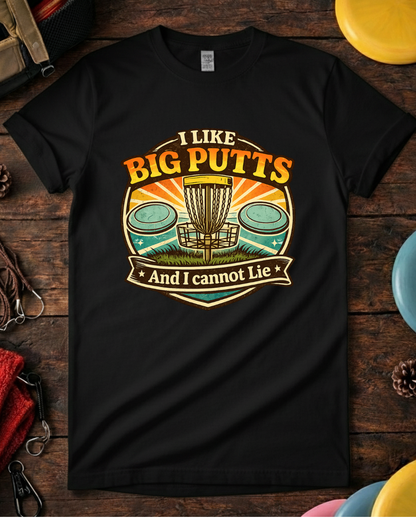 Retro I Like Big Putts disc golf t-shirt with basket, putters and sunset. Unisex retro I Like Big Putts disc golf shirt laid flat with colorful discs.